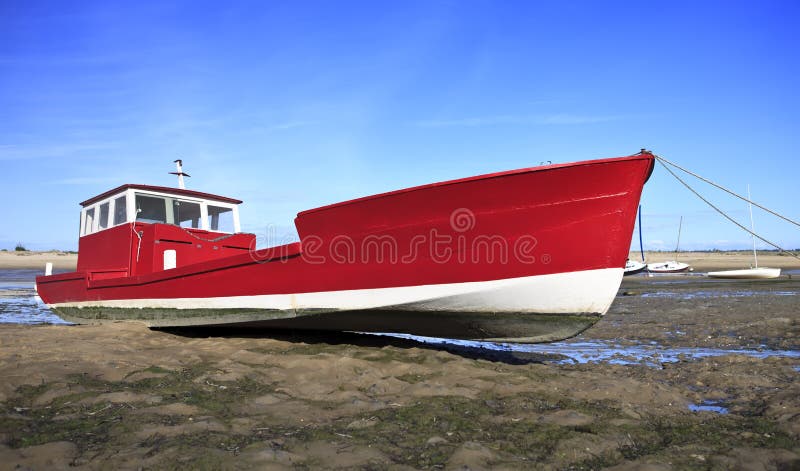 Red boat at low tide in Lege Cap Ferret