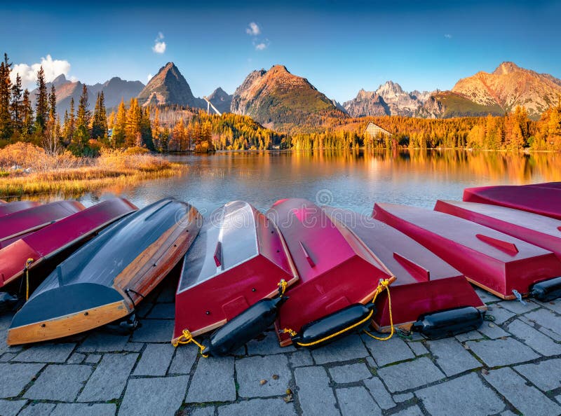 Red boats on the shore of Strbske pleso lake