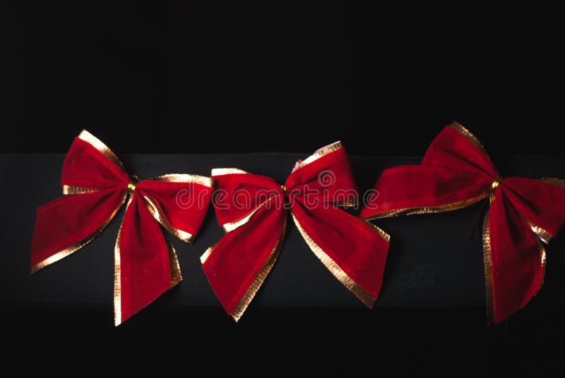 Red Bow on a Black Background, Stock Photo Image of brilliant, object
