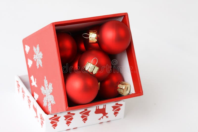 Red Box with Christmas Decoration on White Background Stock Photo