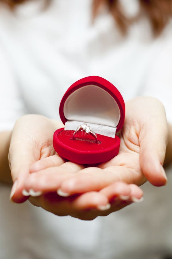 Red box with engagement ring inside