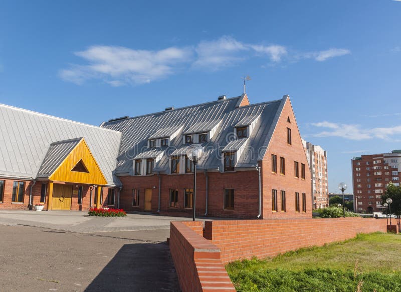 Red brick house in Omsk stock image. Image of clock, roof 26420735