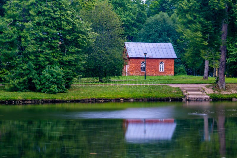 Red Brick House on the Shore of a Pond. Stock Photo Image of surface, architecture 226501920