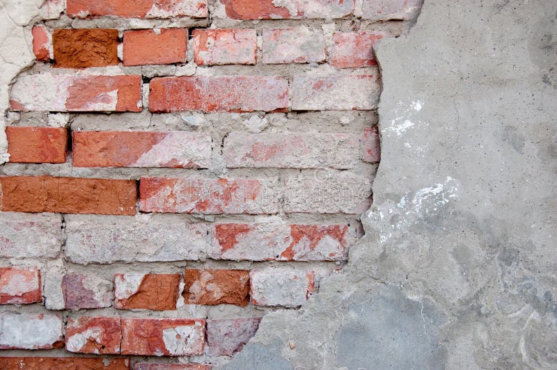 Red brick wall half covered with gray cement a lot of copyspace, blank place for text