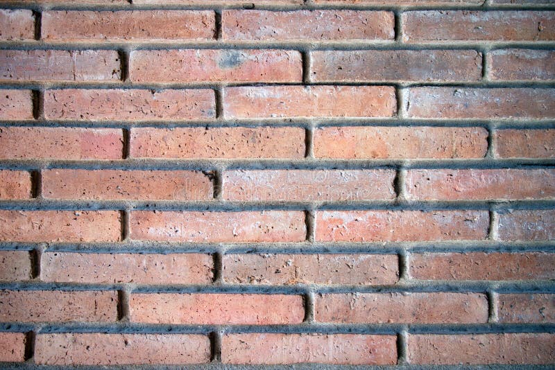 Red bricks wall with hard light and shadow