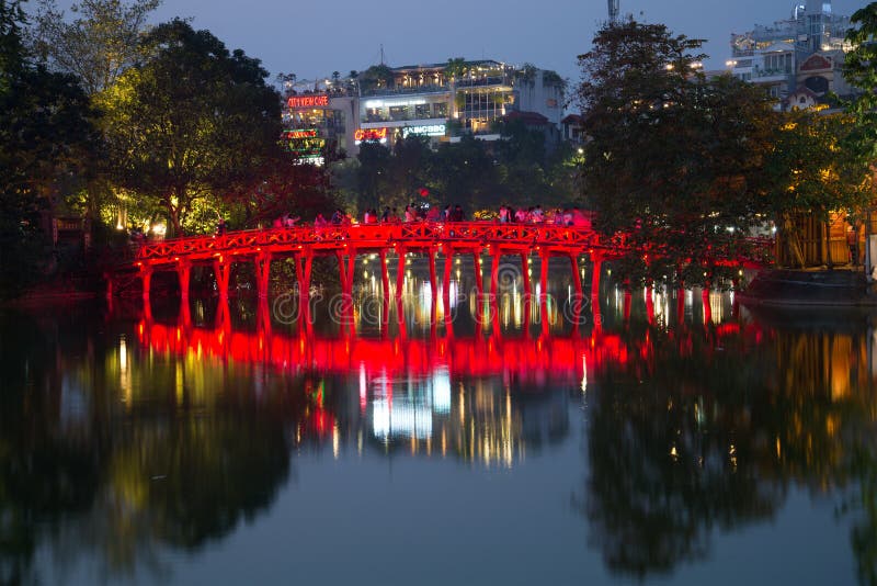 Red bridge Bridge of the Morning light on the Hoan Kiem lake in the evening twilight. Hanoi, Vietnam