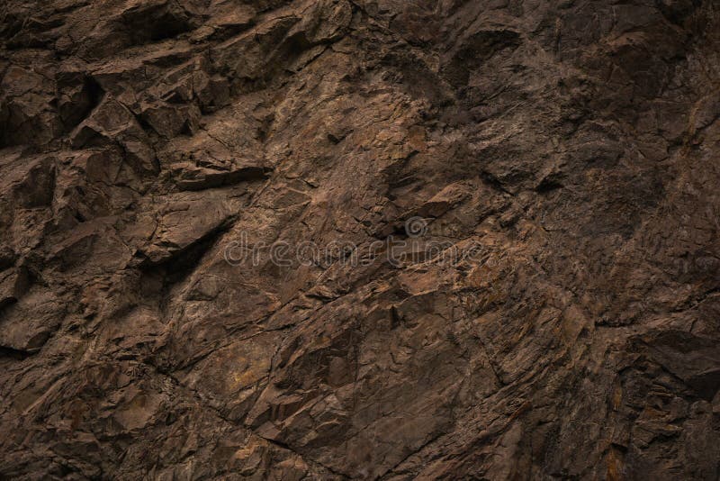 Red brown stone background. Rock surface. Mountain texture. Close-up. stock photo