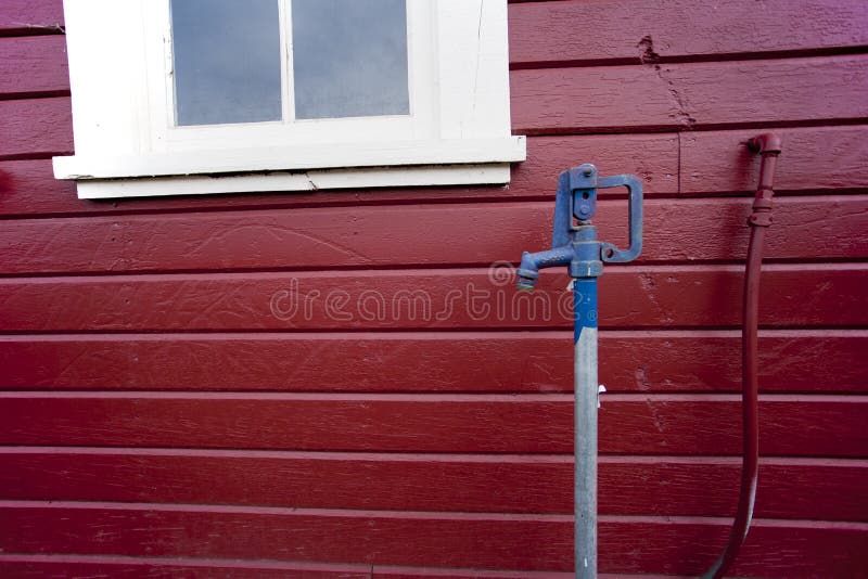 Red building blue faucet.