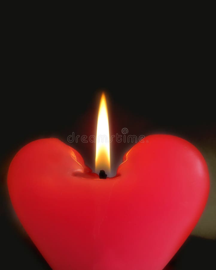 Closeup of a candle with black background. Closeup of a candle with black background