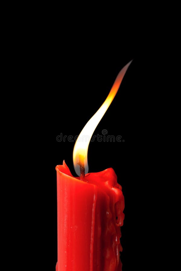 Red candle in black background