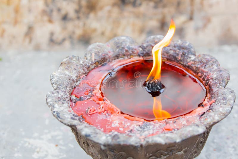 Red candle with liquid wax stock photo. Image of flame 70338044