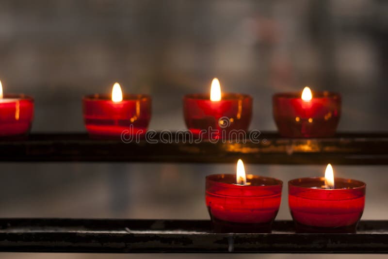 Red candles in a church stock photo. Image of memorial 57506424