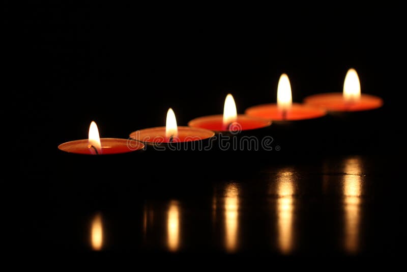 Red candles on dark background
