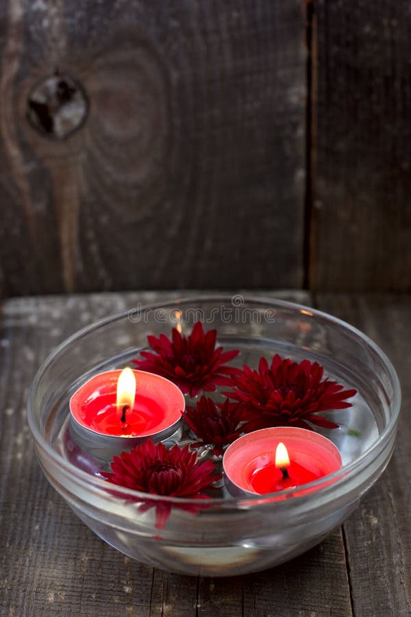 Red Candles and Flowers in a Bowl Stock Image Image of gray, fire