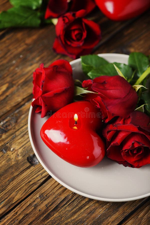 Red roses and candles stock image. Image of floral, love 36016317