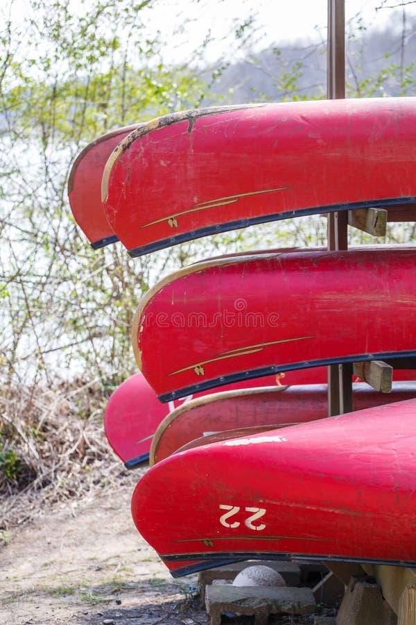 Red Canoes for Rental on Rack Stock Photo Image of canoes, boats