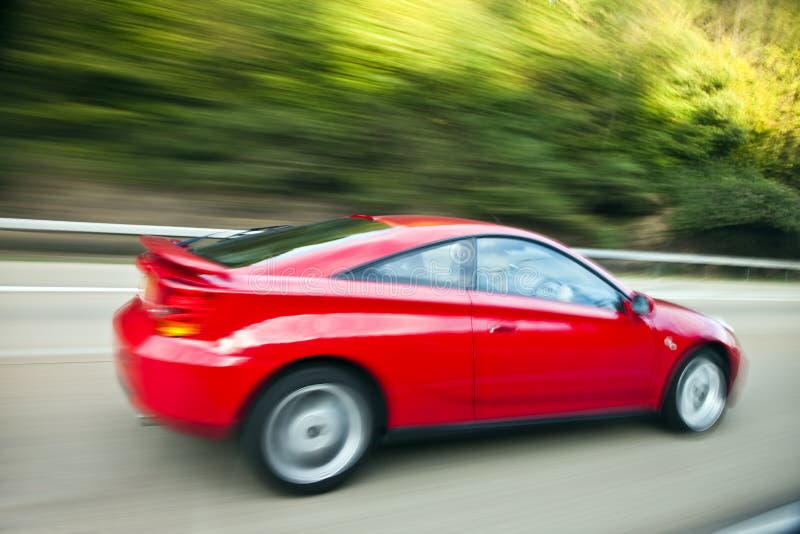 Red Car Driving Fast on Country Road Stock Image Image of direction