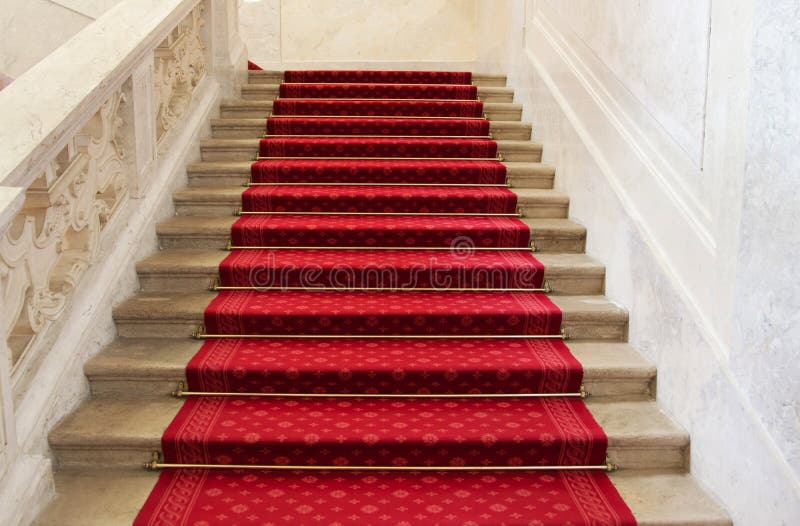 Red carpet on a stairway. Concept or background for richness, fa