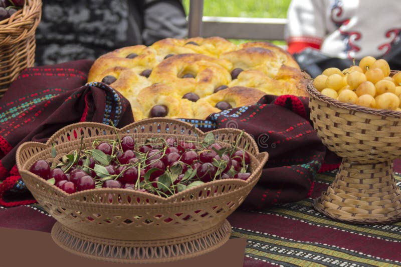 Red cherry and white cherries in knit baskets.