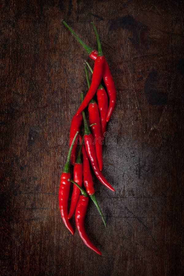 Fresh red chili on wood table