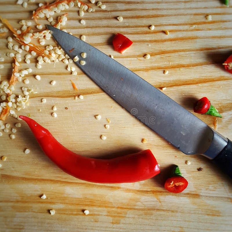 Red chili pepper and knife stock photo. Image of pepper 97583248