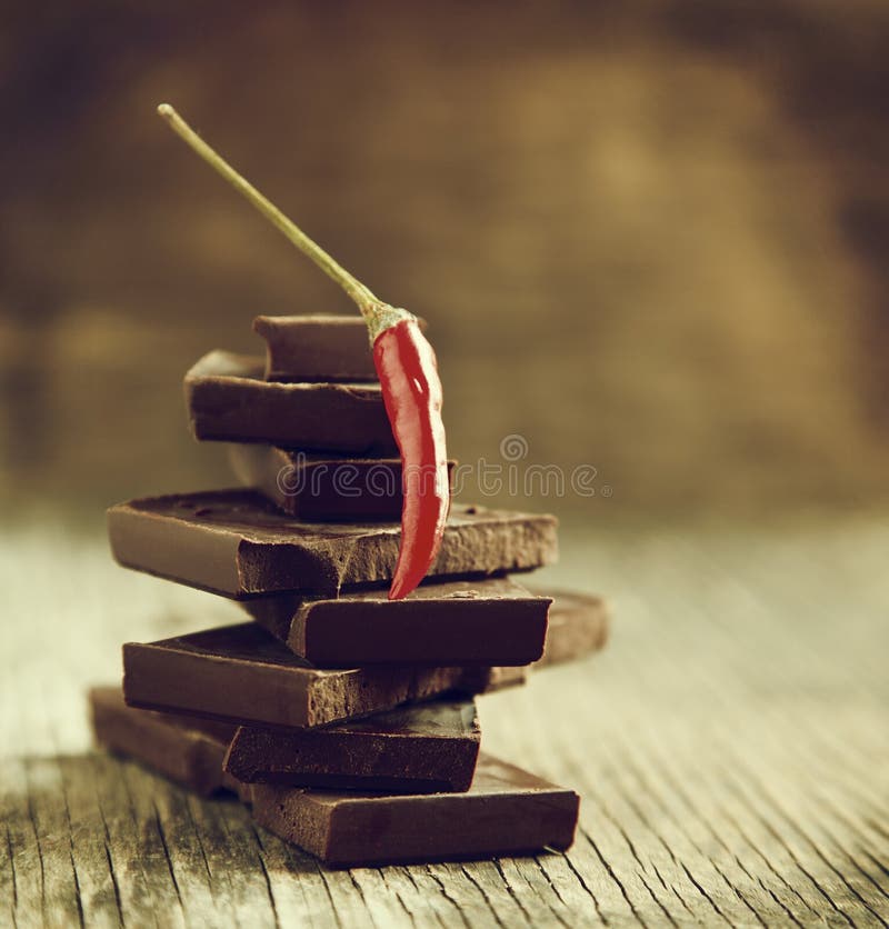 Red Chili Pepper on Stack of Dark Chocolate Pieces Stock Image Image