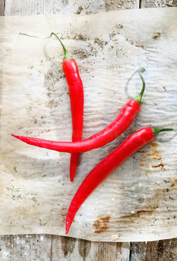 Red chilli peppers on grunge paper