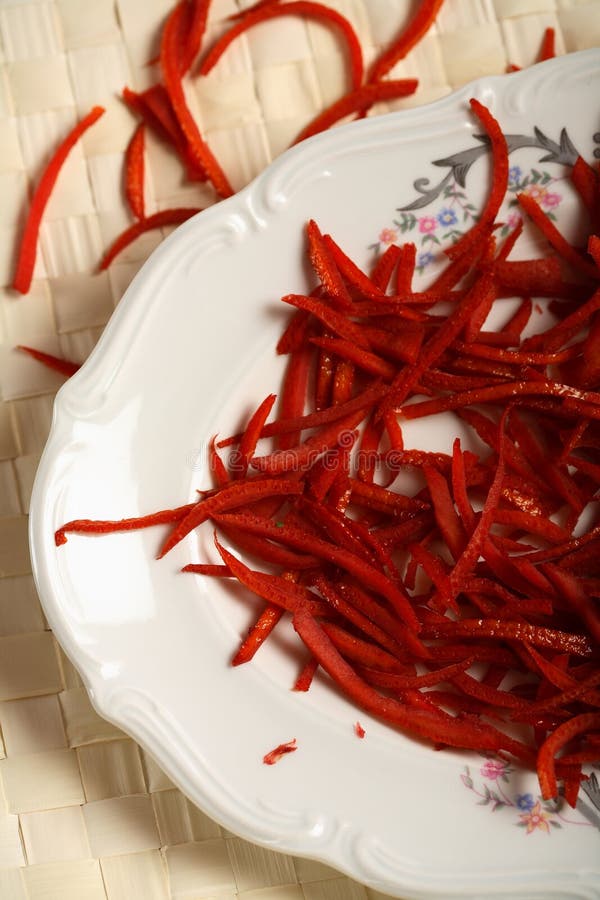 Red chips made from oranges hull on the plate