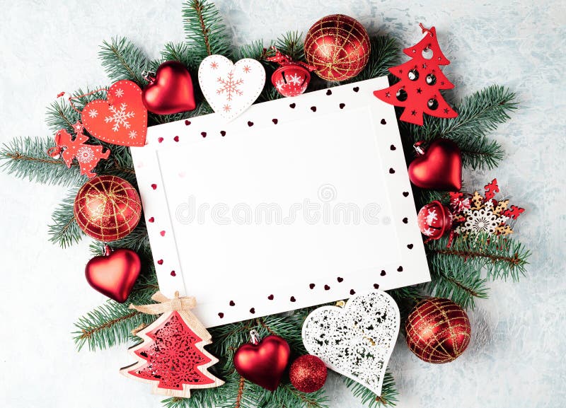 Red christmas background, frame decorated with christmas decorations, heart, ball, christmas tree, star, angel, bell, space for