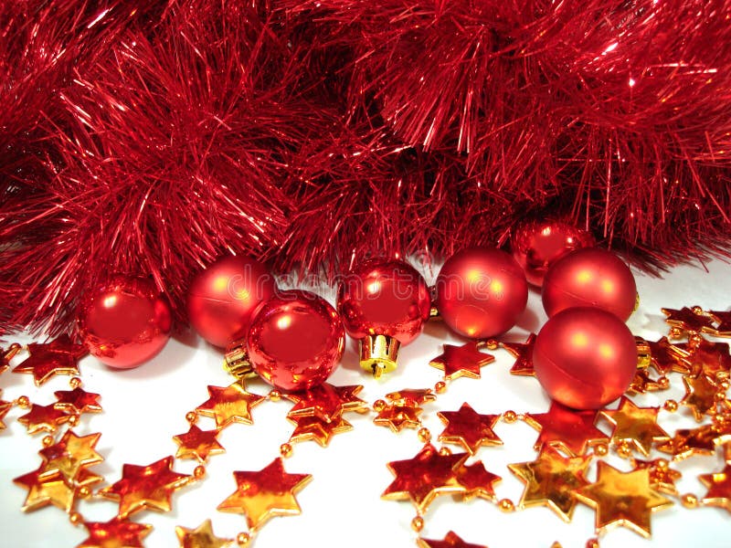 Red Christmas balls and golden stars with garland