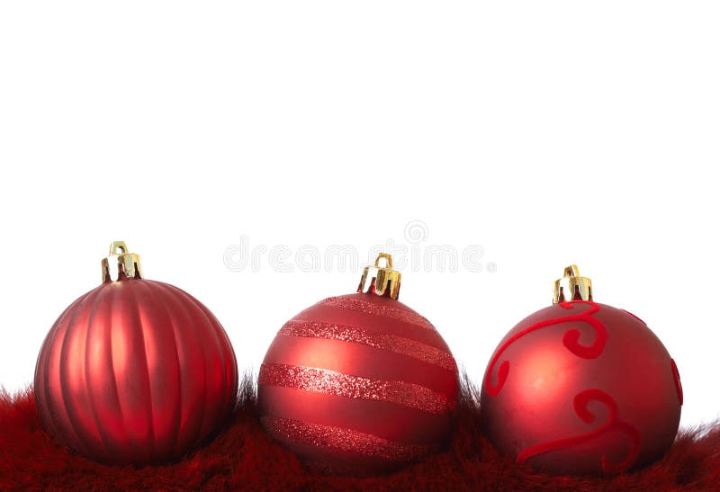 Red Christmas baubles on fur