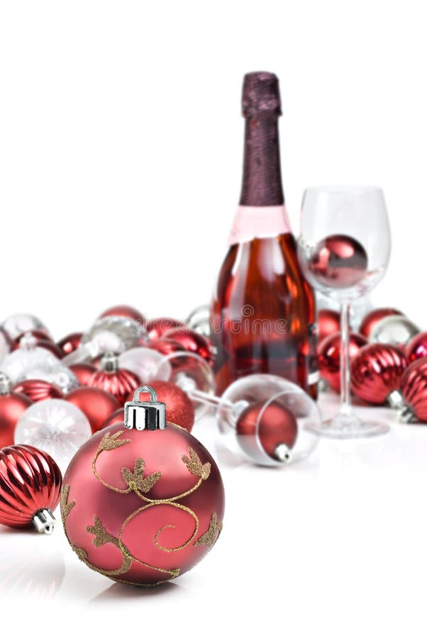 Red christmas ornaments with sparkling wine