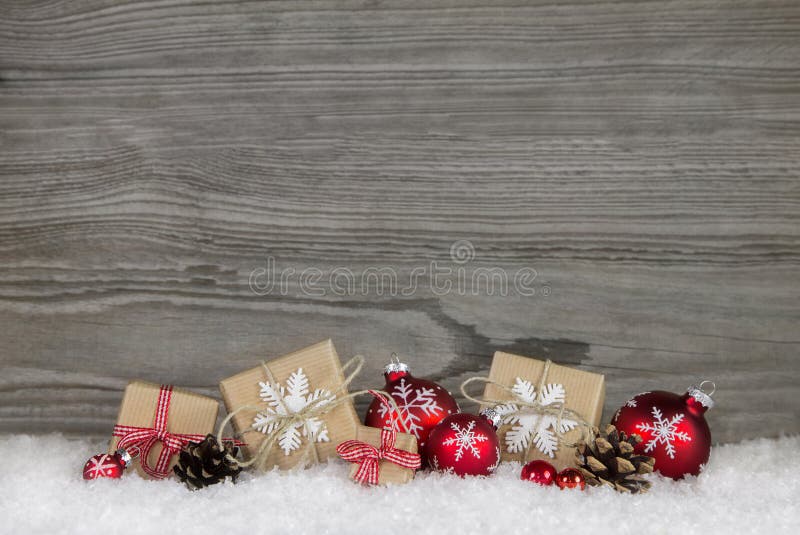 Red Christmas presents wrapped in natural paper on old wooden gr stock photo Red Christmas presents wrapped in natural paper on old wooden gr stock photo