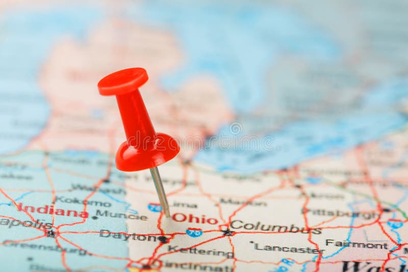 Red clerical needle on a map of USA, South Ohio and the capital Columbus. Close up map of South Ohio with red tack