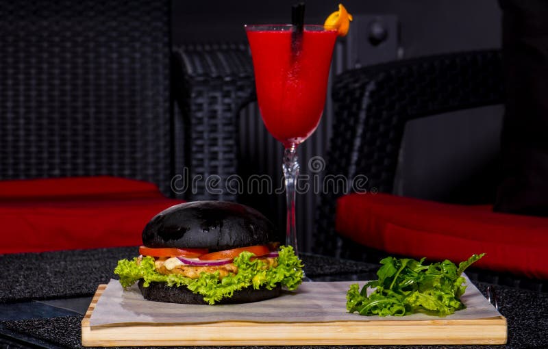 Red cocktail and burger stock image. Image of sofa, food 80640511