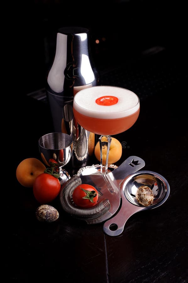 Red Cocktail Drink with Ice. Bar Tools and Shaker. Stock Photo Image