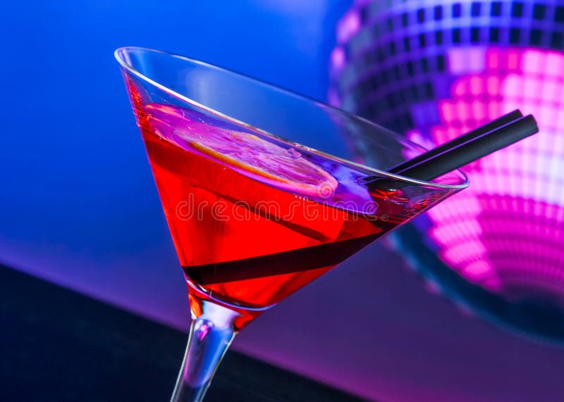Red Cocktail With Sparkling Disco Ball Background With Space For Text
