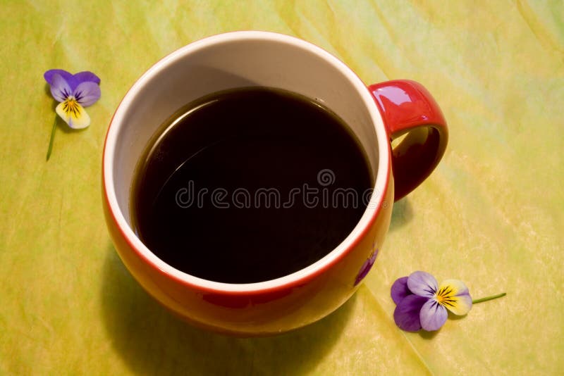 Red Coffee Cup on Green Background