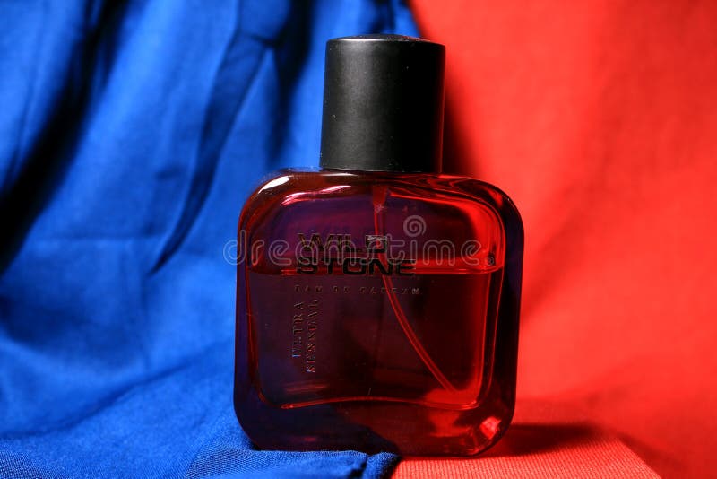 Red Color Men Perfume Bottle Isolated on Red Background with Female ...