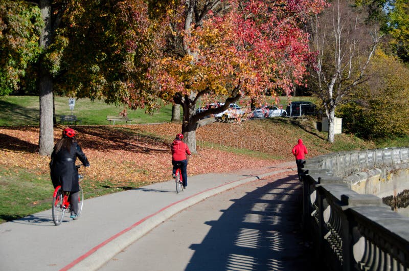 Red colors on runners and bicyclists in Stanley park stock image Red colors on runners and bicyclists in Stanley park stock image