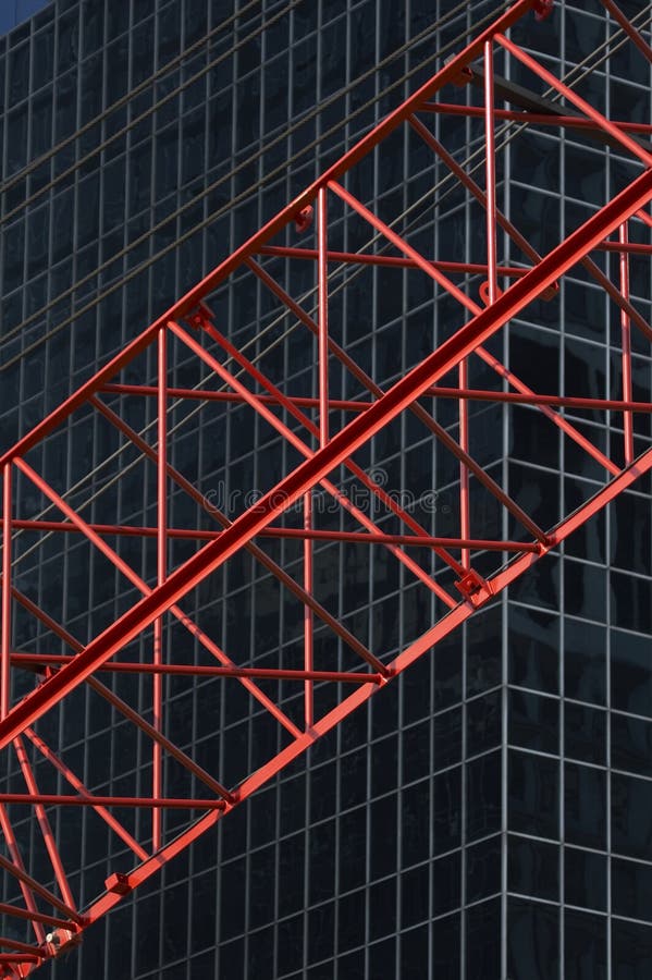 Red construktion cran in front of office building R04