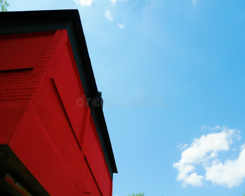 Red Corner of the Building Against the Blue Sky Stock Image Image of