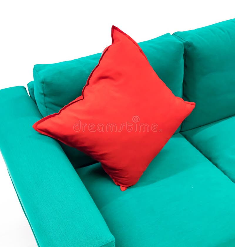 Red Cotton Square Pillow on Green Fabric Sofa Isolated Stock Photo
