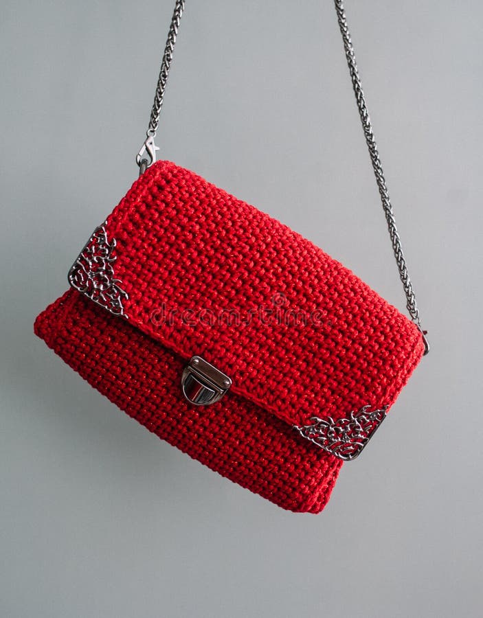 Red Crochet Knitted Bag ,made from Nylon Thread Isolated on Gray