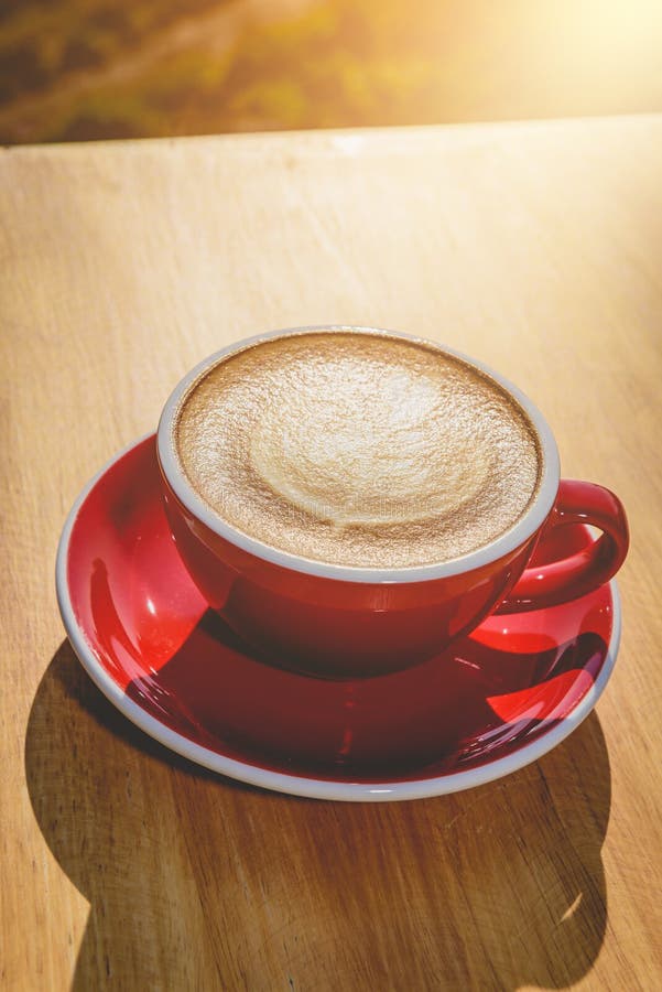 Red Cup Of Hot Latte Coffee With Latte Art Stock Image - Image of table