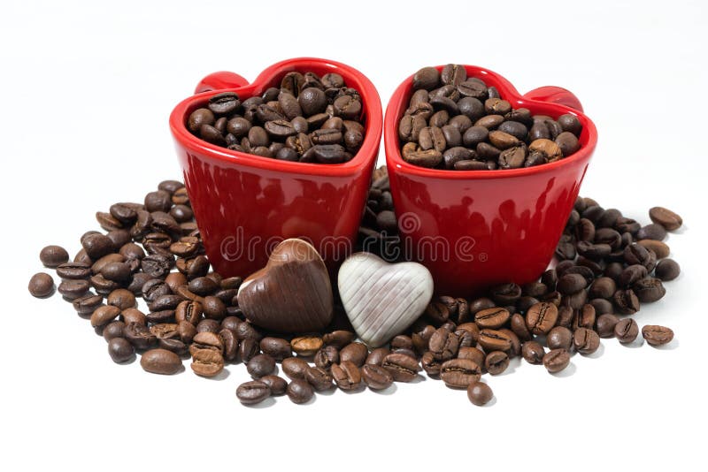 red cups with coffee beans and chocolate candies