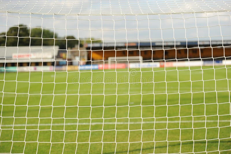 Looking through soccer net to pitch. Looking through soccer net to pitch.