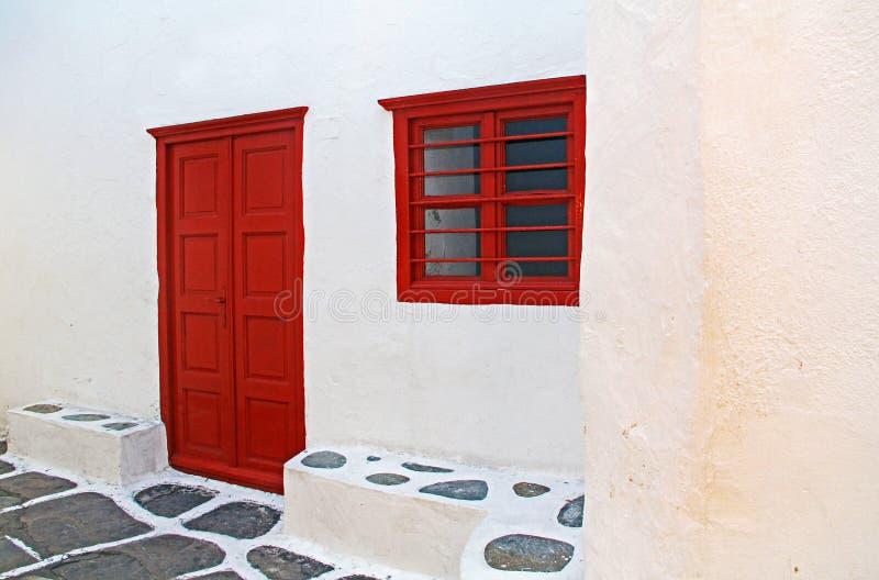 Red Door and window in Mykonos, Greece.