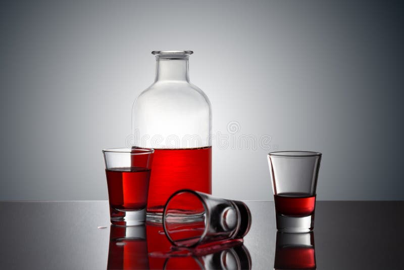 Red Drink on a Glass Bottle Stock Photo Image of drink, pouring