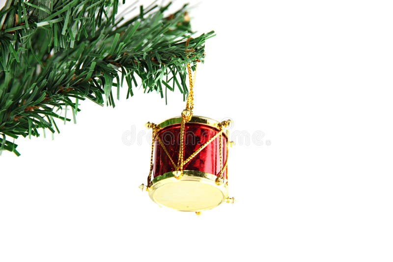 Red Druml hanging on branch Christmas tree.